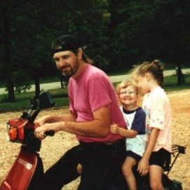 Dad and two kids on an ATV