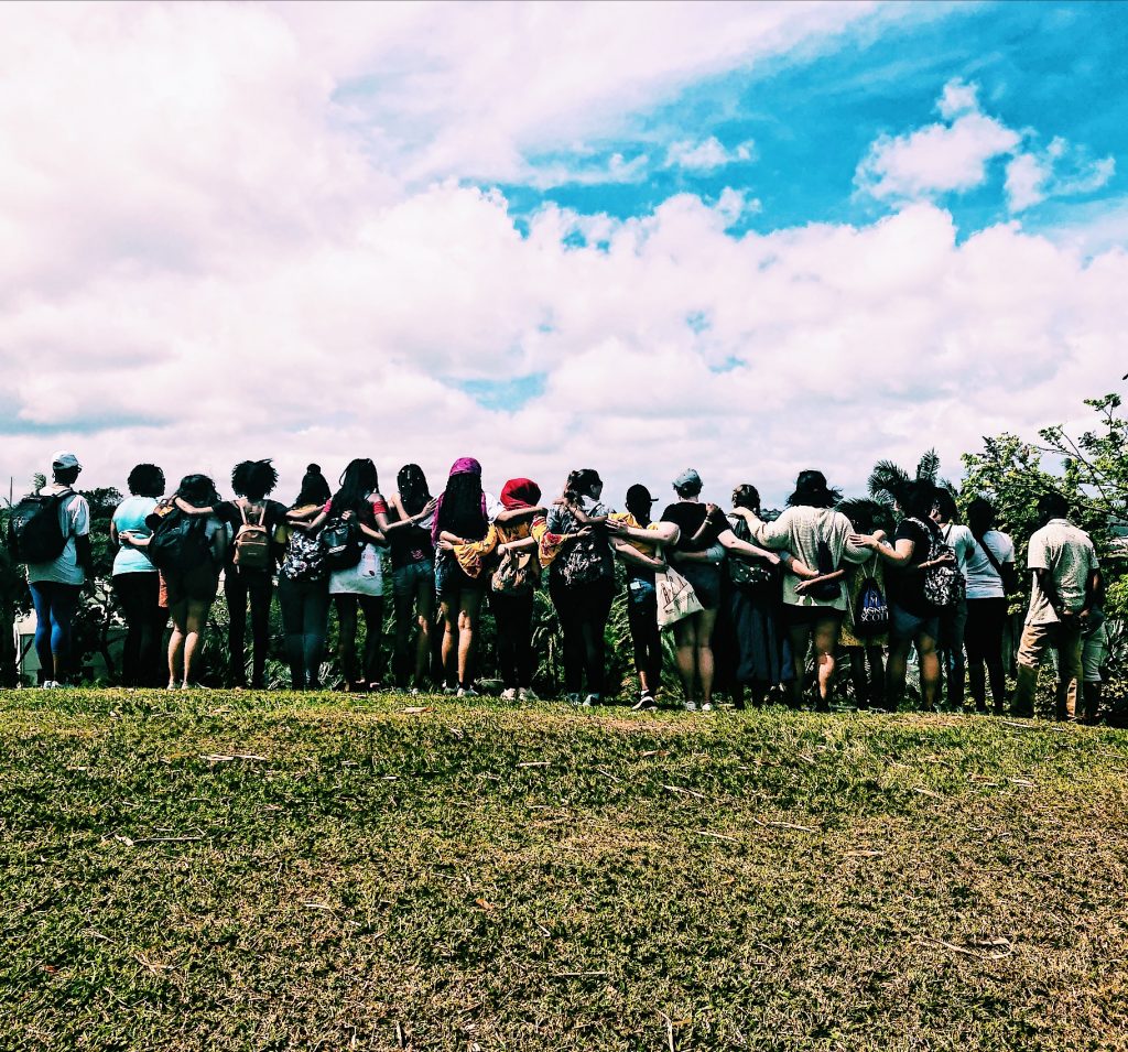 Photo of students with arms around each other in Martinique