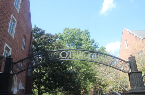 Curved iron arch reading "Agnes Scott College"