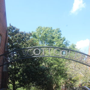 Curved iron arch reading "Agnes Scott College"