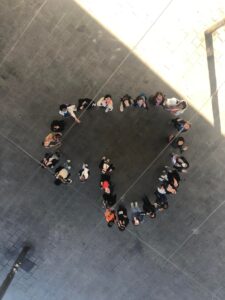 Above shot of students forming a heart