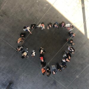 Above shot of students forming a heart