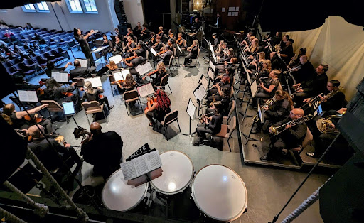 Orchestra featured from above stage.